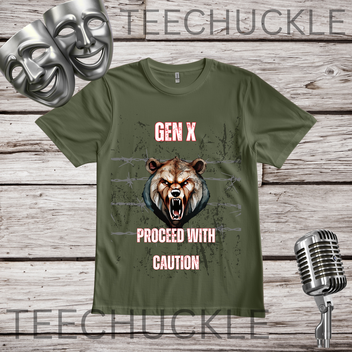 A green graphic t-shirt displayed on a rustic wooden background, featuring a grizzly bear illustration with glowing eyes and the text 'GEN X PROCEED WITH CAUTION' in white. The t-shirt is decorated with silver theater masks and a vintage microphone.