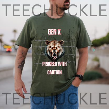 A man standing outdoors wearing a green graphic t-shirt displayed on a rustic wood background, featuring a roaring bear illustration and the text 'GEN X PROCEED WITH CAUTION'.