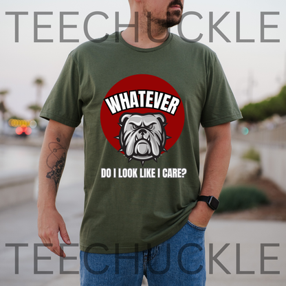 A man wearing a green graphic t-shirt with a red circular bulldog design and the text 'WHATEVER DO I LOOK LIKE I CARE?' on the front, set against an outdoor blurred background. 
