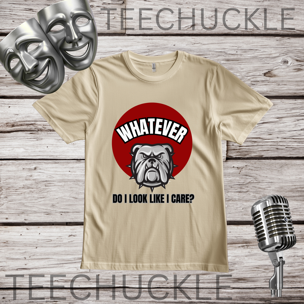 A sand t-shirt on a wooden background with comedy masks and retro microphone in the corners. The shirt has a red circle with a bulldog on it and the text that reads " WHATEVER, DO I LOOK LIKE I CARE"