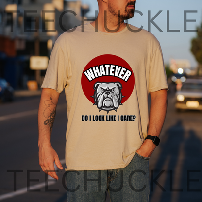 A man wearing a sand graphic t-shirt with a bulldog design and the text 'WHATEVER DO I LOOK LIKE I CARE?' on a blurred street background.