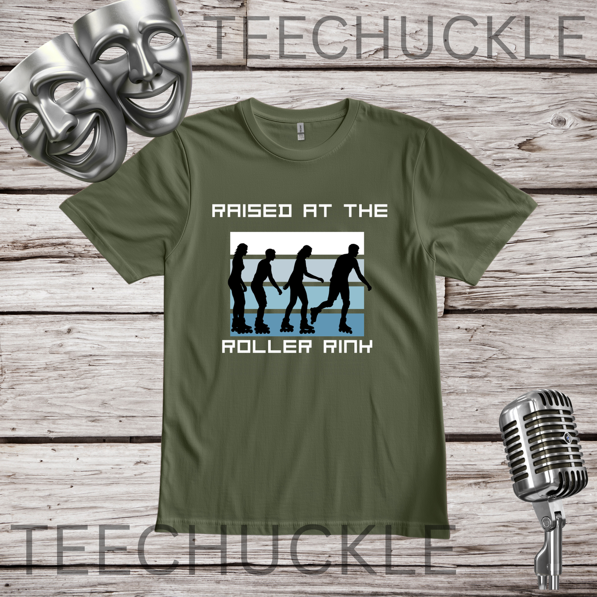 A green graphic t-shirt displayed on a rustic wood background, featuring a white and blue roller rink design with black silhouettes and the text " raised at roller rink". The shirt is decorated with silver theater masks and a vintage microphone prop