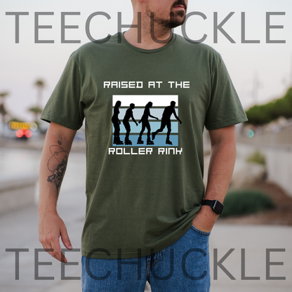 A man wearing a green graphic t-shirt with a 'Raised at the Roller Rink' design, standing outdoors with a blurred background. 