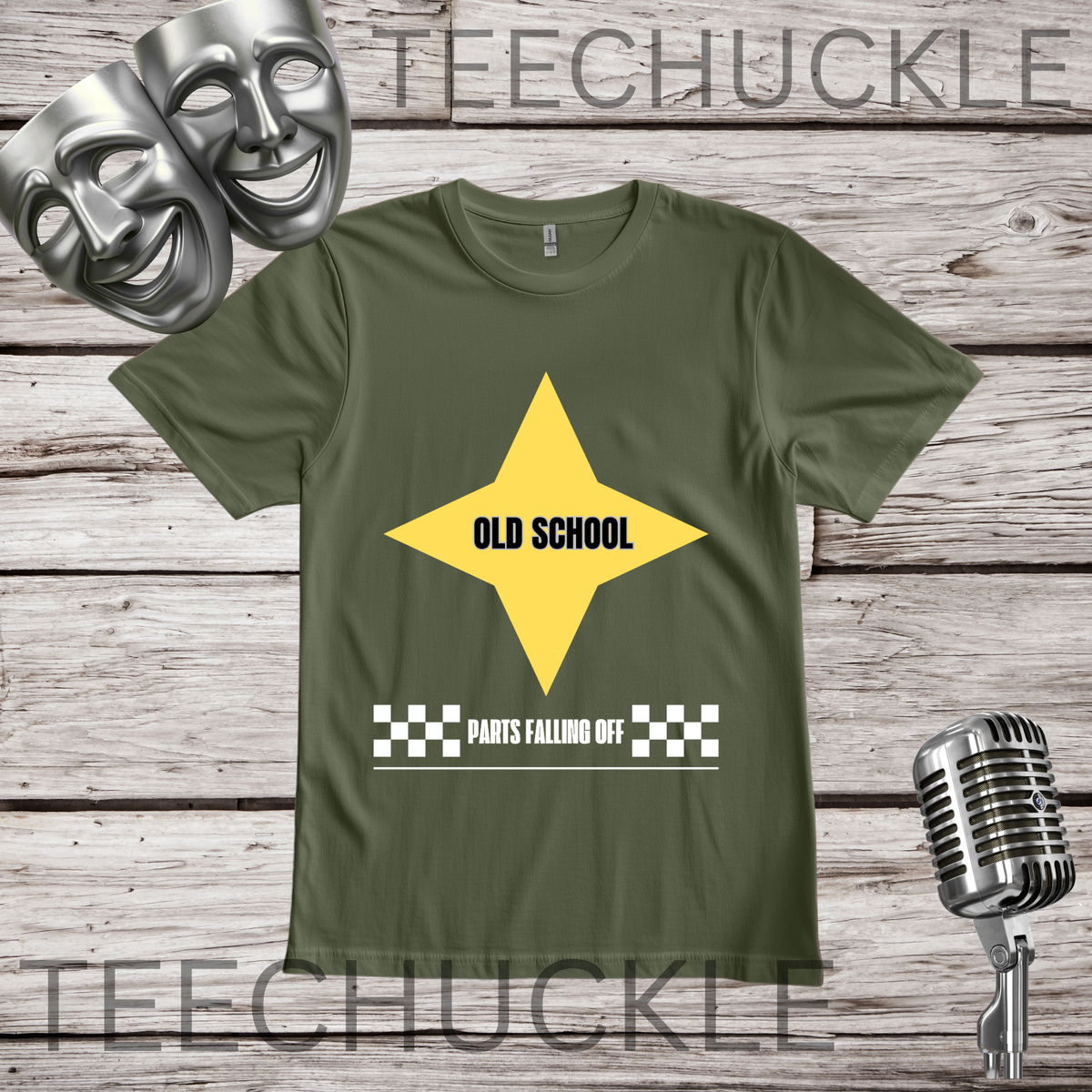 A green graphic t-shirt displayed on a rustic wooden background, styled with silver comedy masks, a vintage microphone. The t-shirt features a yellow star graphic with the text 'OLD SCHOOL' and a checkered bar below reading 'PARTS FALLING OFF'.