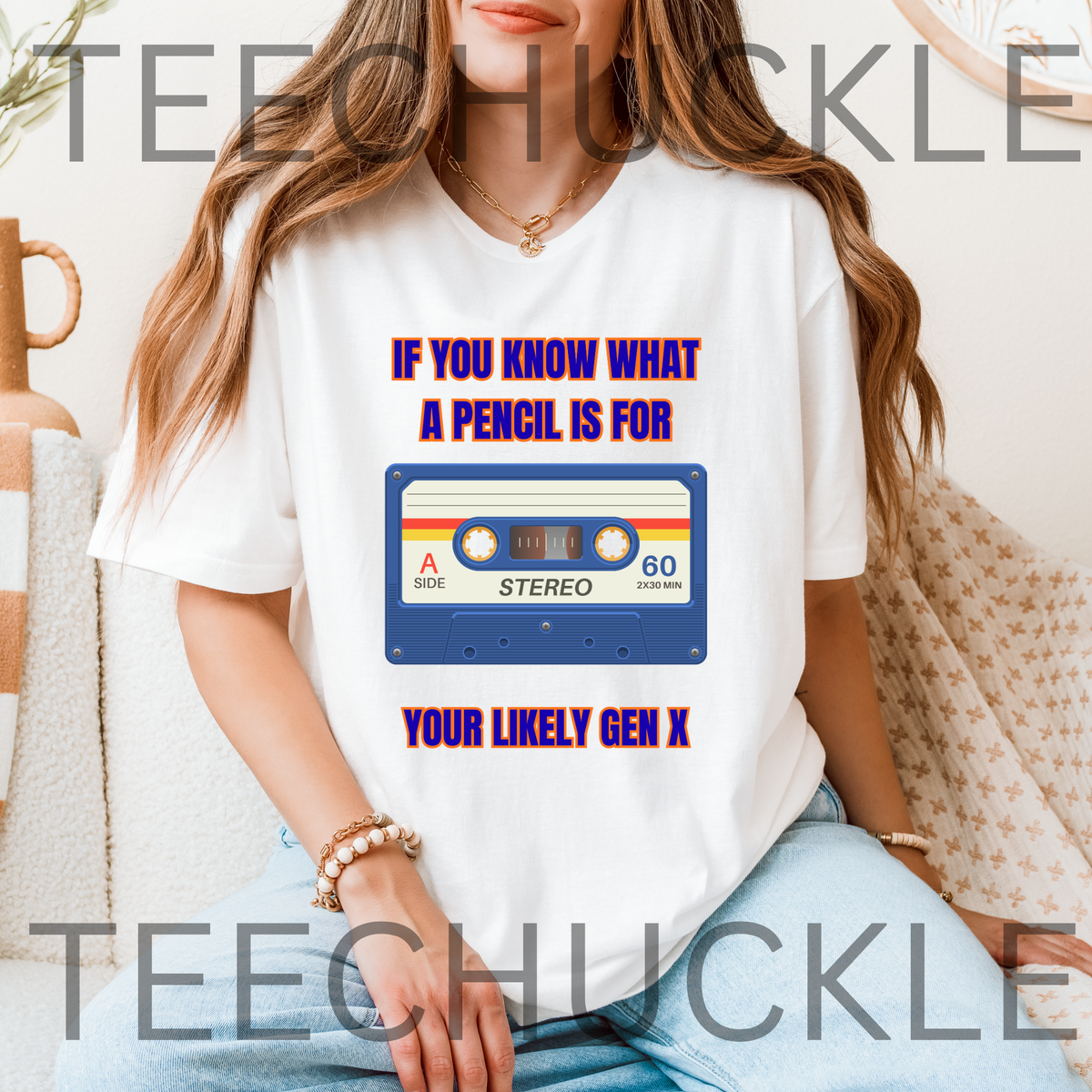 A woman sitting on a couch wearing a white t-shirt with a cassette ape graphic and text " IF YOU KNOW WHAT A PENCIL IS FOR YOUR LIKELY GEN X"