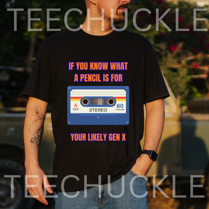 A man wearing a black graphic t-shirt with a retro cassette tape design and the text 'IF YOU KNOW WHAT A PENCIL IS FOR YOUR LIKELY GEN X'. The background is a blurred outdoor setting