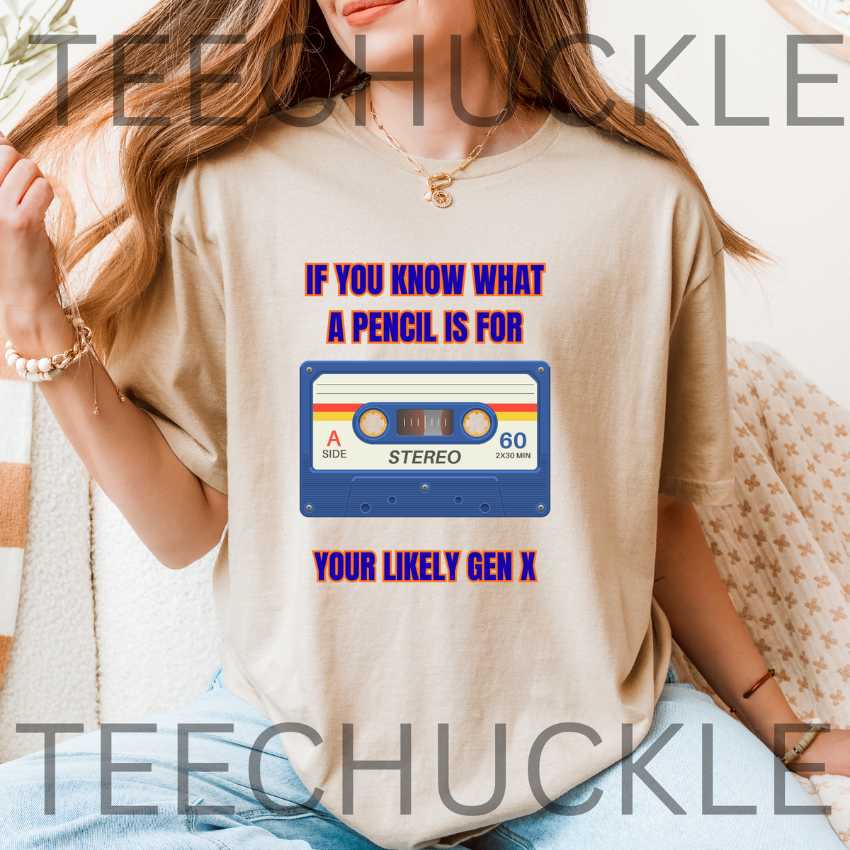 A woman wearing a sand graphic t-shirt with a retro cassette tape design and the text 'IF YOU KNOW WHAT A PENCIL IS FOR YOUR LIKELY GEN X'.