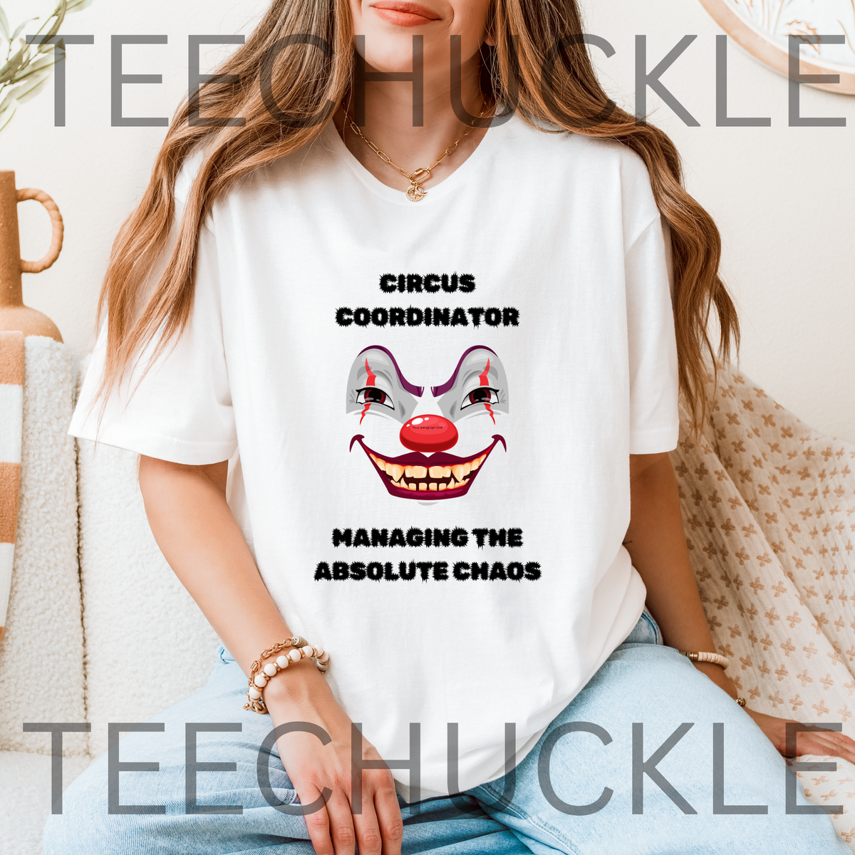 A woman wearing a white graphic t-shirt with a creepy clown face and the text 'CIRCUS COORDINATOR' and 'MANAGING THE ABSOLUTE CHAOS'.