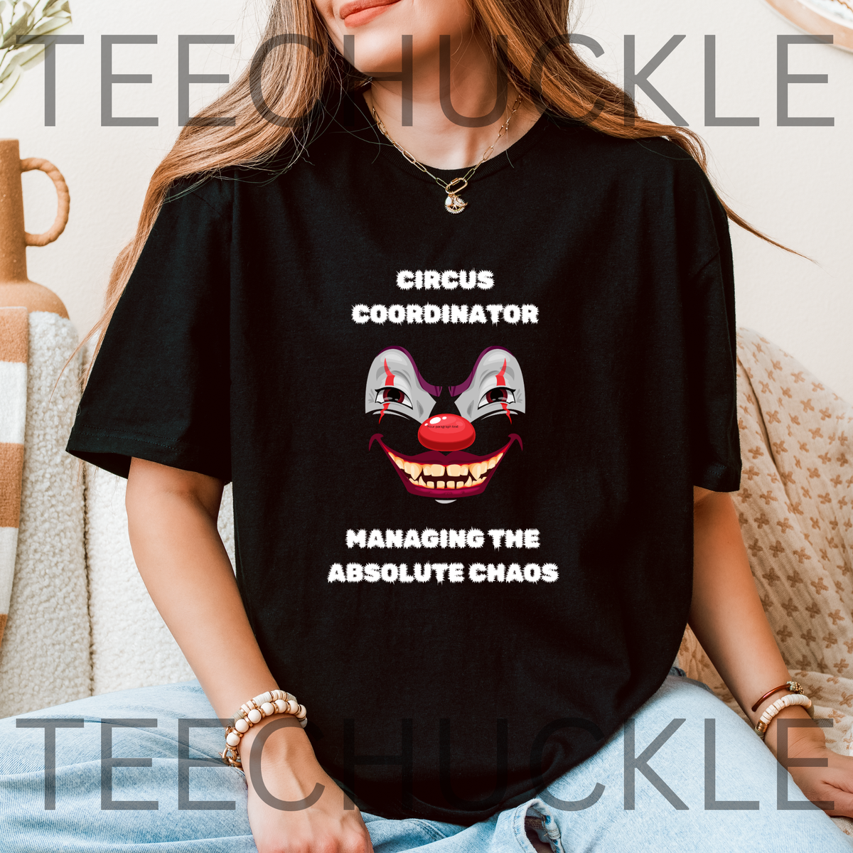 A woman wearing a black graphic t-shirt with a clown face and the text 'CIRCUS COORDINATOR' and 'MANAGING THE ABSOLUTE CHAOS'. 