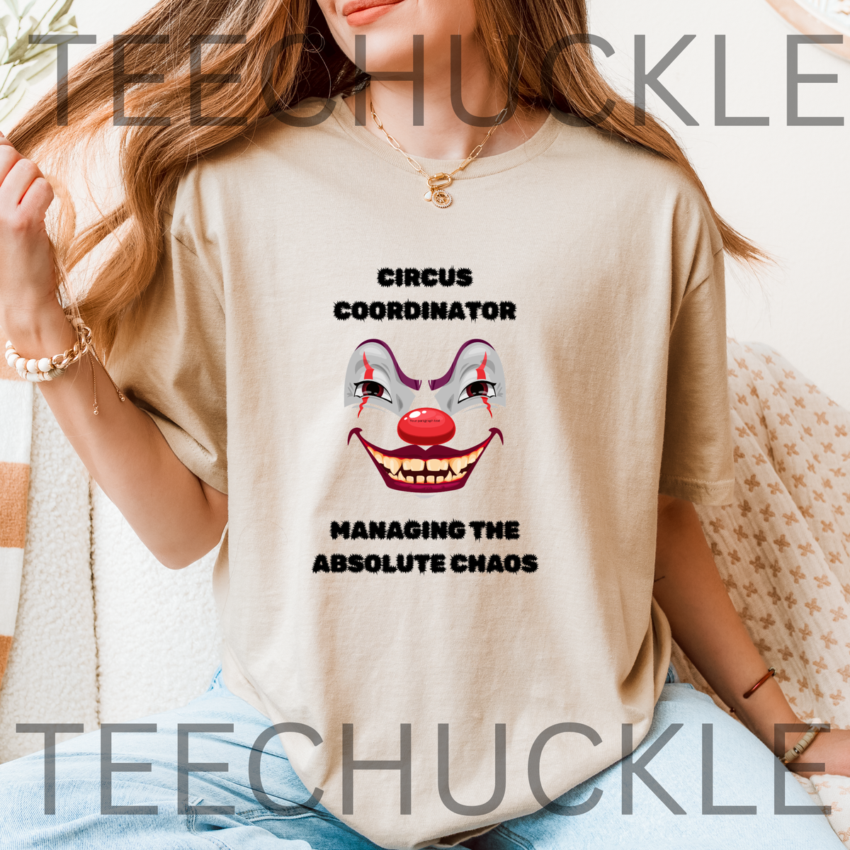 A woman wearing a sand graphic t-shirt with a clown face and the text 'CIRCUS COORDINATOR' and 'MANAGING THE ABSOLUTE CHAOS'.