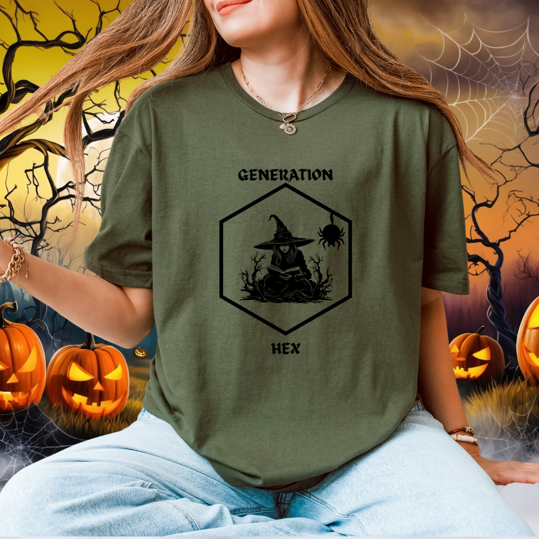 A woman wearing a green graphic t-shirt with a black witch-themed design that reads 'GENERATION HEX'. The background is a spooky Halloween scene with pumpkins, cobwebs, and bare trees.