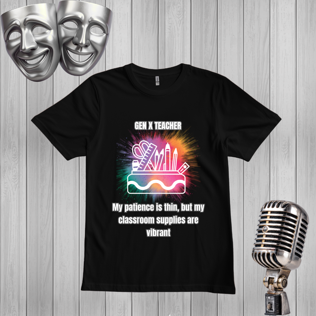 A black short-sleeve graphic T-shirt displayed on a light gray wood plank background, with two silver theater masks in the top left and a vintage silver microphone in the bottom right. The shirt features a colorful classroom-supplies illustration and the text 'GEN X TEACHER My patience is thin, but my classroom supplies are vibrant'.