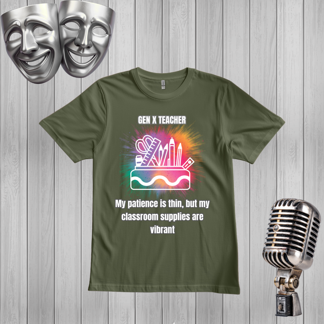 A GREEN graphic t-shirt displayed on a gray wood plank background, flanked by silver-themed props including two comedy masks at the top left and a vintage microphone at the bottom right. The t-shirt features a colorful watercolor-style graphic of classroom supplies with the text 'GEN X TEACHER My patience is thin, but my classroom supplies are vibrant'.