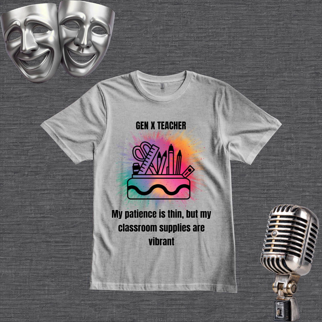 A gray graphic t-shirt displayed on a dark gray textured background, styled with two silver comedy masks in the top-left corner and a vintage silver microphone in the bottom-right corner. The t-shirt features a colorful watercolor-style illustration of school supplies (ruler, scissors, pencils, eraser) with the text 'GEN X TEACHER My patience is thin, but my classroom supplies are vibrant'.