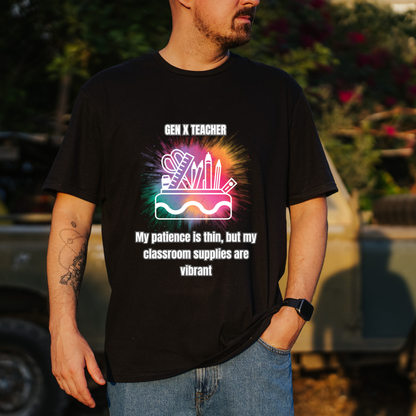 A man wearing a black graphic t-shirt with a colorful 'Gen X Teacher' design, standing outdoors in front of a blurred vehicle and foliage.
