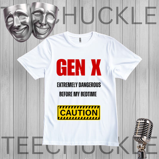 A white graphic t-shirt displayed on a gray wood-plank background, featuring the text 'GEN X EXTREMELY DANGEROUS BEFORE MY BEDTIME' in red and black, and a yellow caution-style box. Silver theater masks and a vintage microphone are placed around the shirt, with large 'TEECHUCKLE' watermarks across the image.