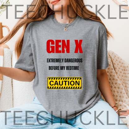 A woman wearing a gray graphic t-shirt with the text 'GEN X EXTREMELY DANGEROUS BEFORE MY BEDTIME' in red and black, and a yellow 'CAUTION' sign graphic.