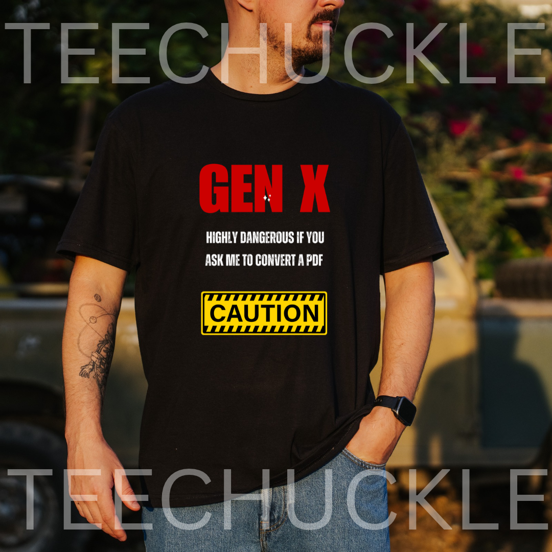 A black graphic t-shirt . The shirt features the text 'GEN X' in bold red letters, followed by 'HIGHLY DANGEROUS IF YOU ASK ME TO CONVERT A PDF' in black, and a yellow 'CAUTION' warning label graphic.