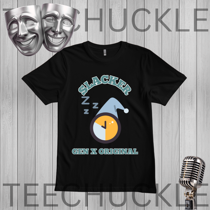 A black short-sleeve graphic T-shirt displayed on a gray wood-plank background, with a theatrical comedy and tragedy masks icon in the top left and a vintage microphone icon in the bottom right. The graphic features the text 'SLACKER' in a light teal arched font above a sleeping clock illustration with 'Z Z Z' marks, and 'GEN X ORIGINAL' in light teal below.