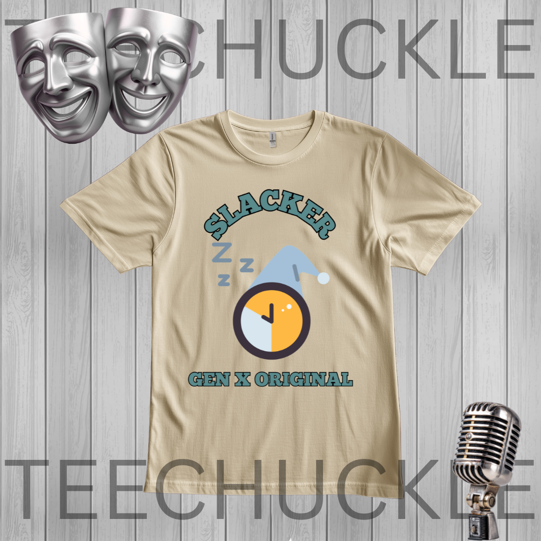 A sand graphic t-shirt featuring a 'Slacker Gen X Original' design with a clock and z-z-z icons, displayed on a gray wood plank background with theatrical masks and a vintage microphone. 