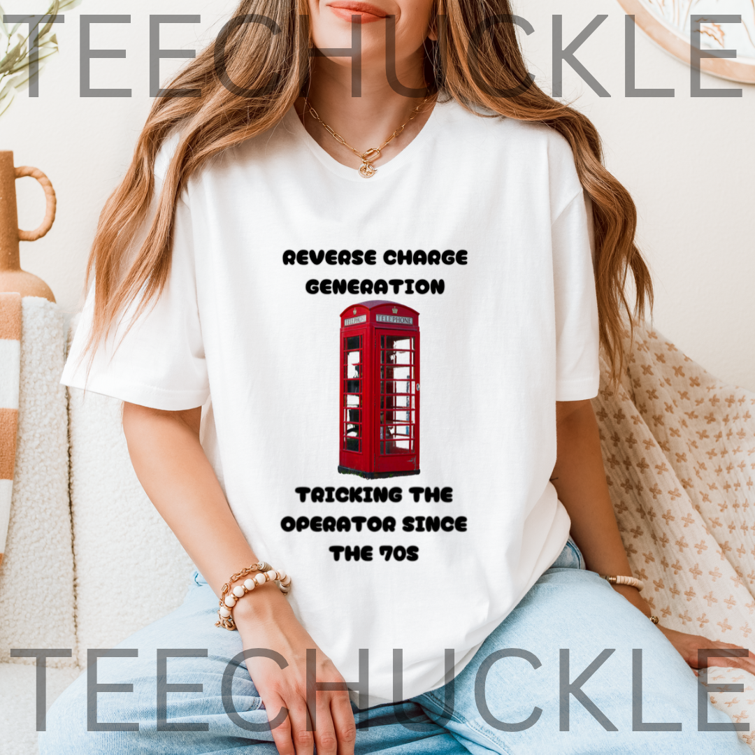 A woman wearing a white graphic t-shirt with a red telephone booth print and the text 'REVERSE CHARGE GENERATION TRICKING THE OPERATOR SINCE THE 70s'.