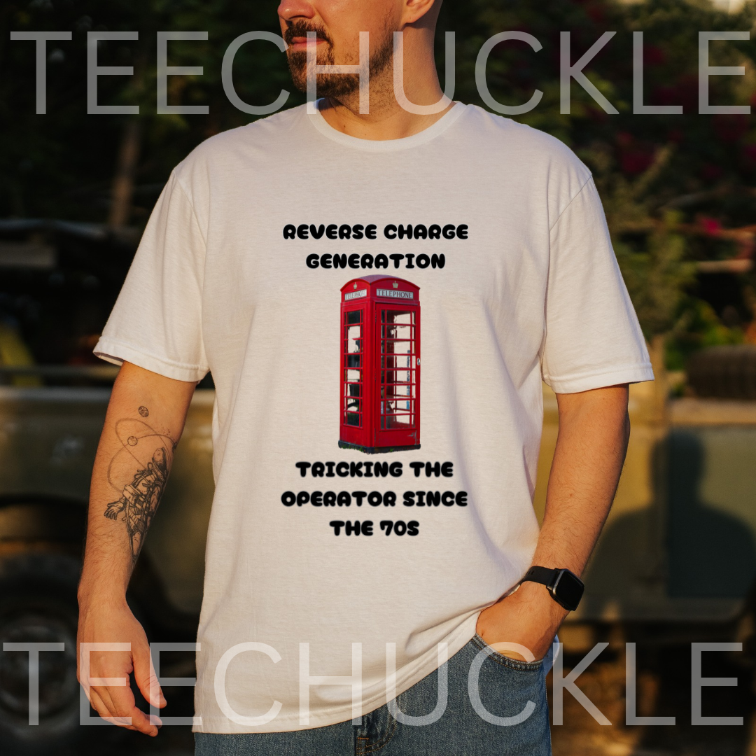 A man wearing a white graphic t-shirt with a red telephone booth print and black text reading 'REVERSE CHANGE GENERATION' and 'TRICKING THE OPERATOR SINCE THE 70S'. The background is a blurred outdoor setting, 