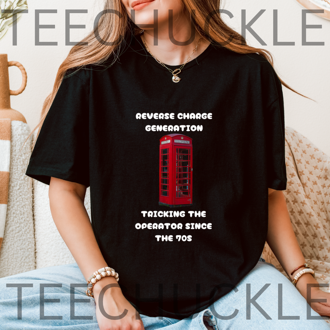 A black short-sleeve graphic t-shirt featuring a red telephone booth and black text that reads 'REVERSE CHARGE GENERATION' and 'TRICKING THE OPERATOR SINCE THE 70s'. 