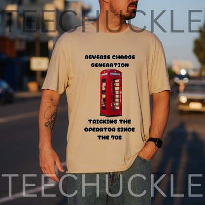 A man wearing a sand graphic t-shirt with a red telephone booth and the text 'REVERSE CHARGE GENERATION TRICKING THE OPERATOR SINCE THE 1970s' on a blurred street background. 
