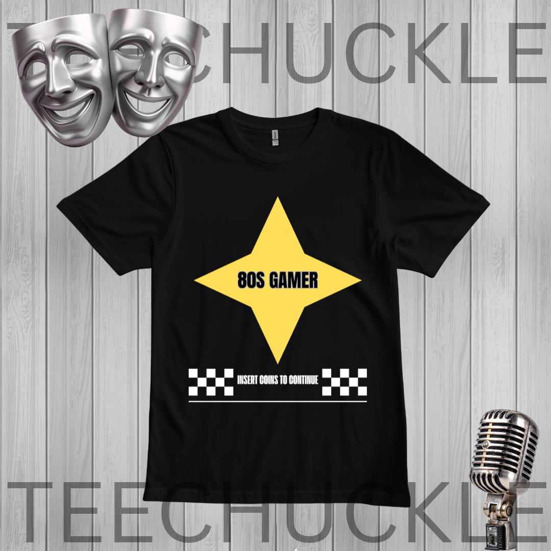 A black short-sleeve graphic t-shirt displayed flat against a gray wood-plank background. The shirt features a large yellow star graphic with the text '80S GAMER' in black, and a white text bar below reading 'INSERT COINS TO CONTINUE' flanked by black-and-white checkered squares.
