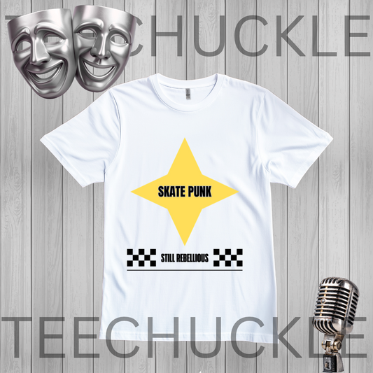 A white short-sleeve t-shirt with a graphic design featuring a yellow star, the text 'SKATE PUNK' in black, and 'STILL REBELIOUS' with checkered bars. The shirt is displayed on a gray wood-plank background with silver theater masks and a vintage microphone,