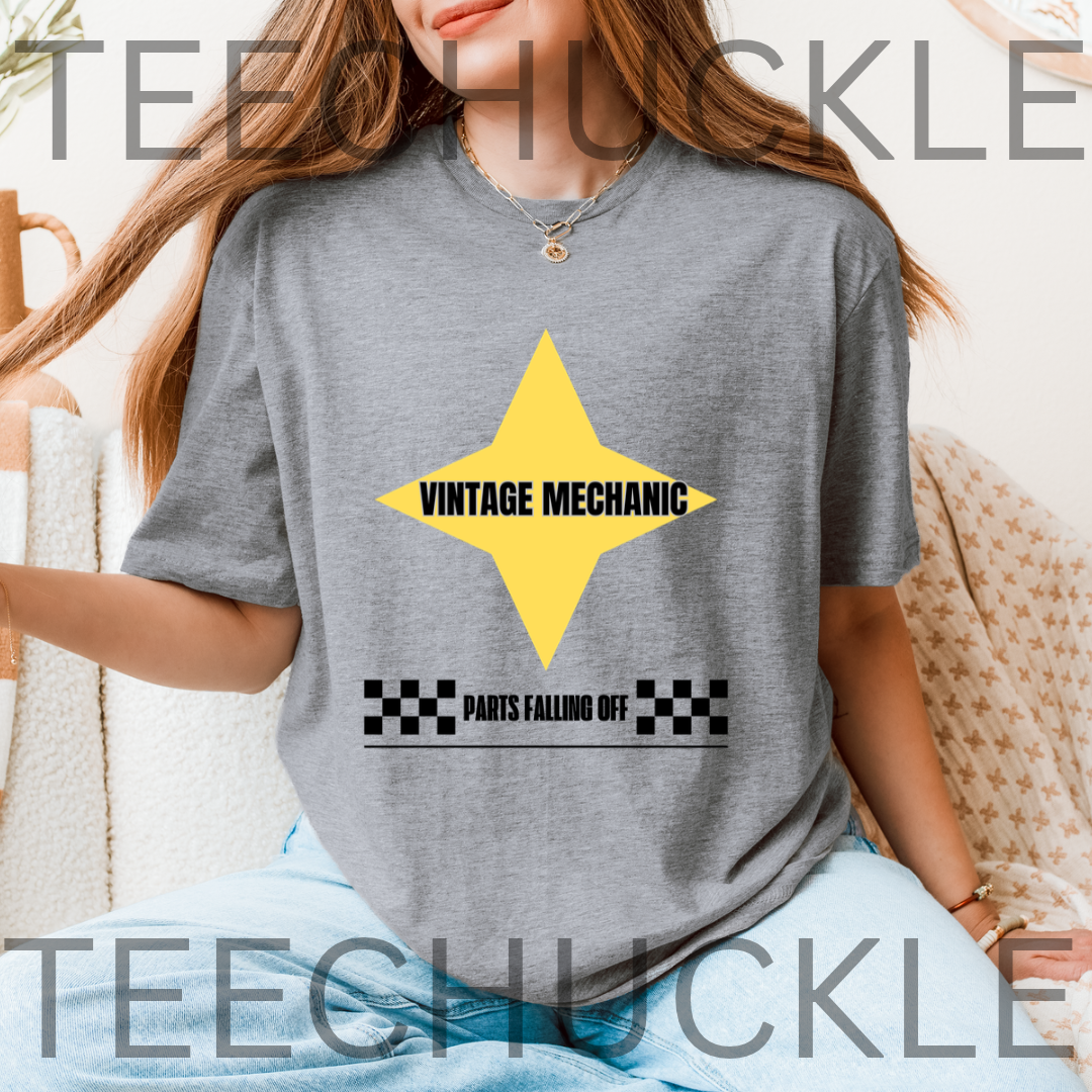 A woman wearing a gray t-shirt with a yellow star graphic and the text '80S GAMER' and 'INSERT COIN TO CONTINUE' on the front. 