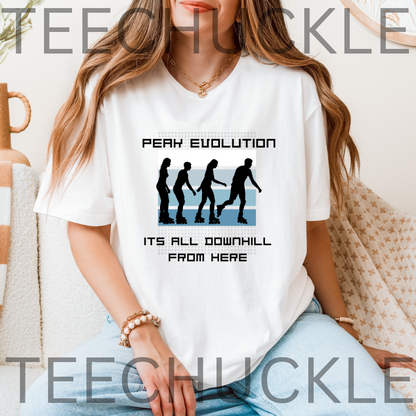 A woman wearing a white graphic t-shirt with a black and blue downhill silhouette design and the text 'PEAK EVOLUTION ITS ALL DOWNHILL FROM HERE'.