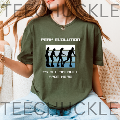 A woman wearing a green graphic t-shirt with the text 'PEAK EVOLUTION ITS ALL DOWNHILL FROM HERE' and roller skate silhouettes, sitting on a couch. 