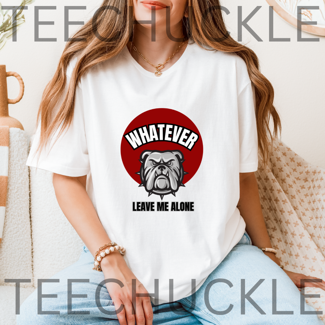 A woman wearing a white graphic t-shirt with a red circular bulldog design and the text 'WHATEVER LEAVE ME ALONE'. 