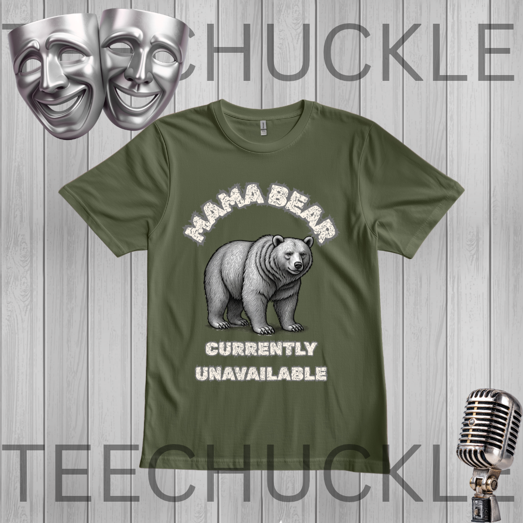 A green graphic t-shirt featuring a white and gray illustration of a grizzly bear with the text 'MAHA BEAR' above and 'CURRENTLY UNAVAILABLE' below. The t-shirt is displayed on a gray wood-plank background with decorative props including a silver microphone, theater masks