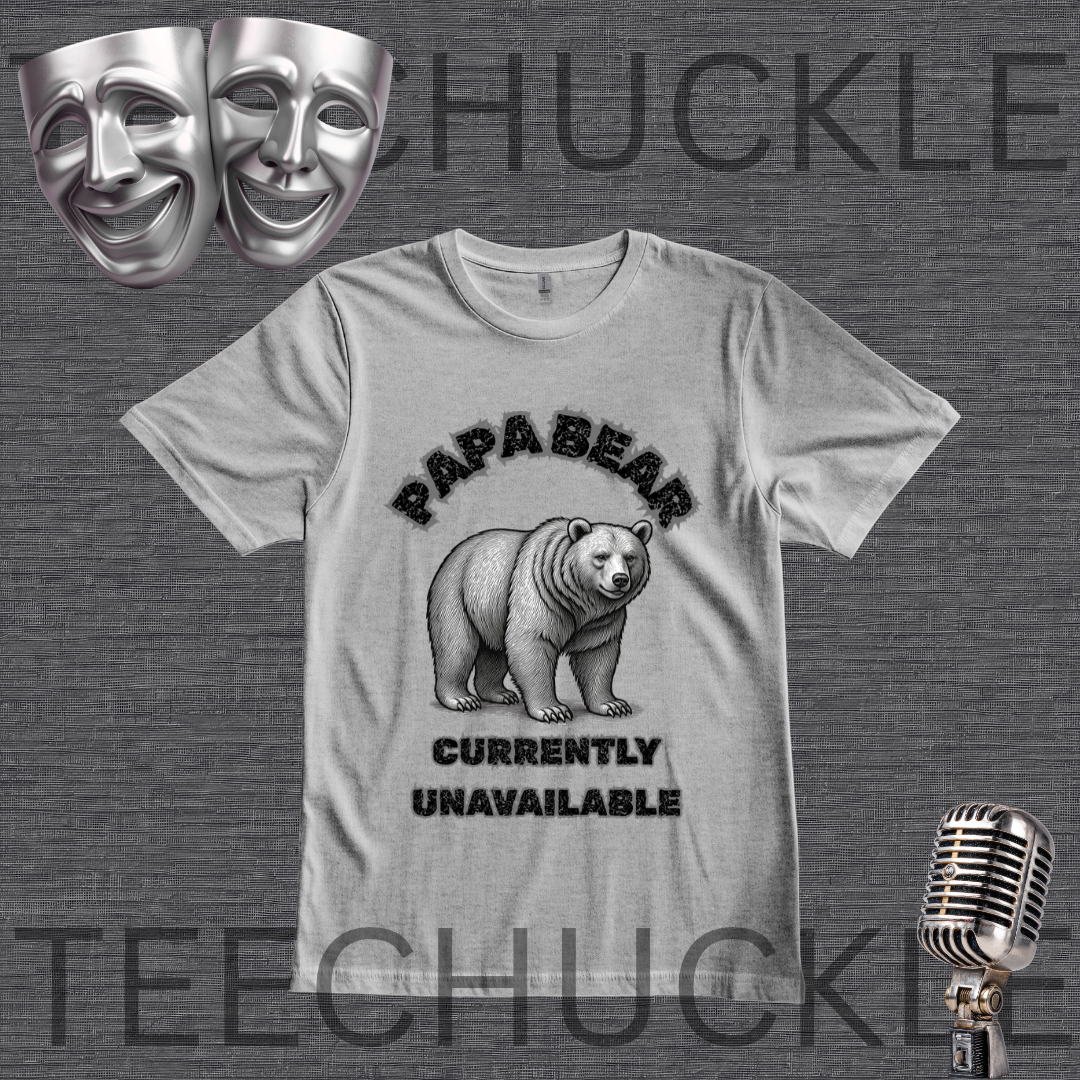 A gray graphic t-shirt featuring a black bear illustration and the text 'PAPA BEAR CURRENTLY UNAVAILABLE'. The t-shirt is displayed on a dark gray textured background with a 'TEECHUCKLE' watermark, accompanied by two silver comedy masks in the top-left and a vintage silver microphone in the bottom-right.