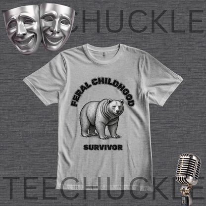 A light gray graphic t-shirt featuring a black and white illustration of a grizzly bear with the text 'FERAL CHILDHOOD SURVIVOR'. The t-shirt is displayed on a dark gray textured background with theatrical comedy and tragedy masks, a vintage microphone