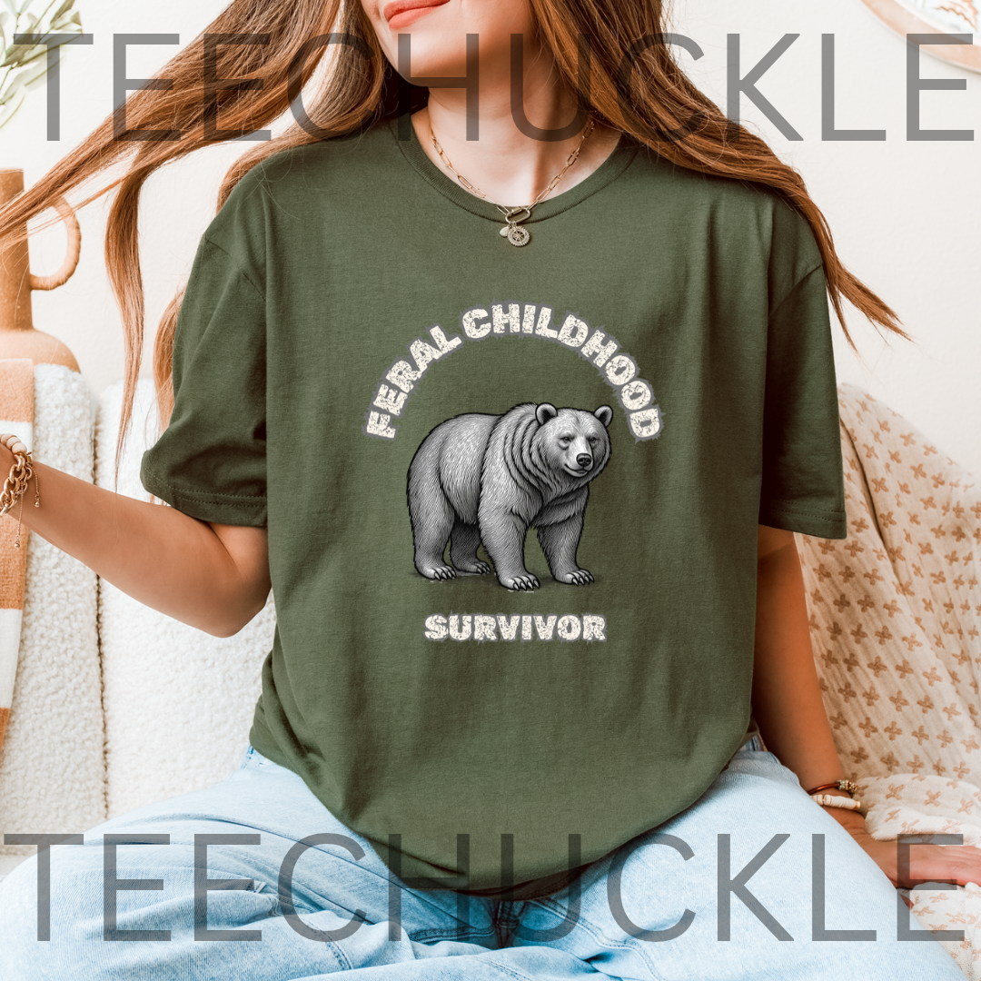 A woman wearing an oversized green graphic t-shirt with a black and white polar bear illustration and the words 'FERAL CHILDHOOD SURVIVOR'.