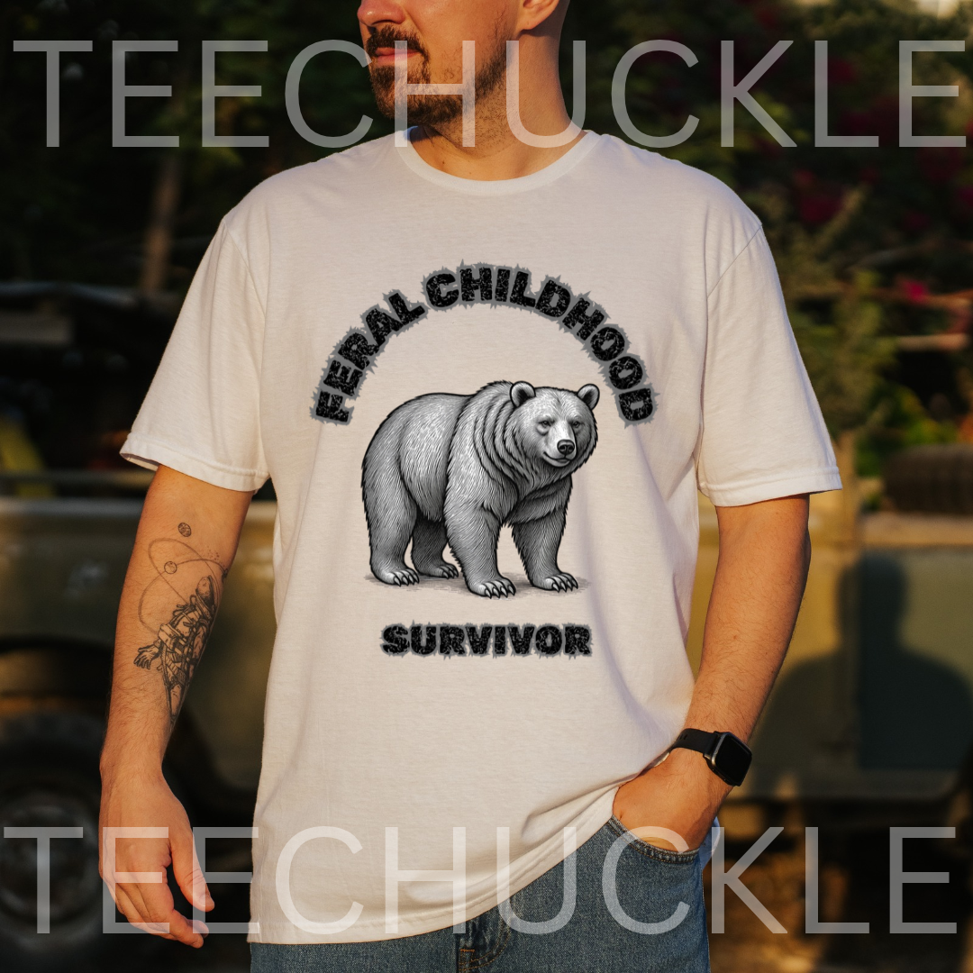 A man wearing a white graphic t-shirt with a black and gray bear design and the text 'FERAL CHILDHOOD SURVIVOR'. The background is an outdoor setting with a blurred vehicle, 