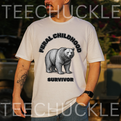 A man wearing a white graphic t-shirt with a black and gray bear design and the text 'FERAL CHILDHOOD SURVIVOR'. The background is an outdoor setting with a blurred vehicle, 