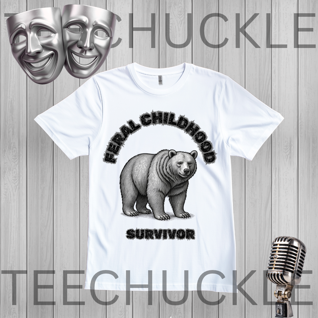 A white short-sleeve graphic T-shirt laid flat on a gray wood-plank background. The shirt features a black-and-gray illustration of a bear with the words 'FERAL CHILDHOOD SURVIVOR' in black.