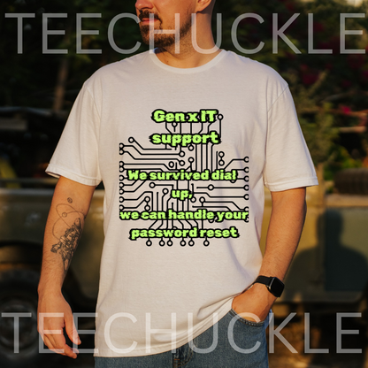 A man wearing a white graphic t-shirt with a green and black circuit board design and the text 'Gen.x IT support We survived dial up, we can handle your password reset'.