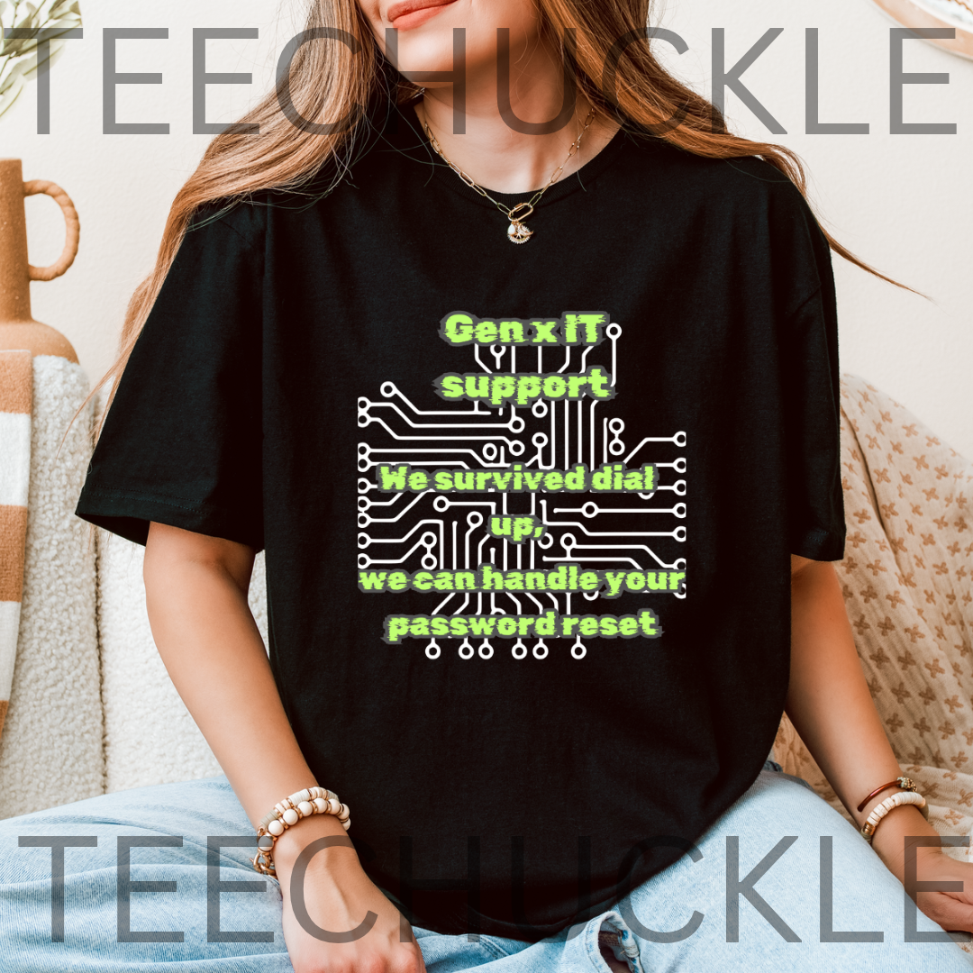 A woman wearing a black graphic t-shirt with a green and white circuit board design and the text 'Gen x IT support We survived dial up we can handle your password reset'. 