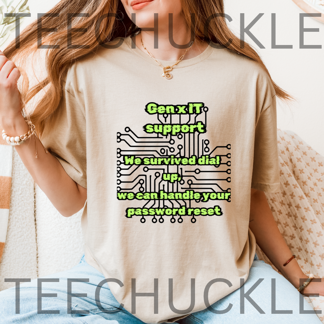A woman wearing a sand graphic t-shirt with a green and black circuit board design and the text 'Gen x IT support We survived dial up we can handle your password reset'. 