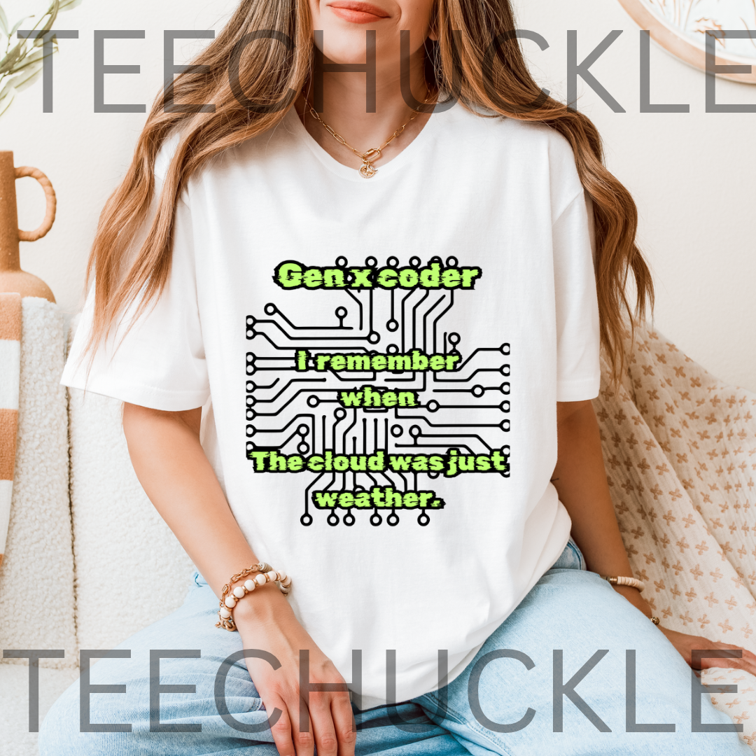 A woman wearing a white graphic T-shirt with green and black text reading 'Gen x coder I remember when the cloud was just weather.' over a circuit board design.