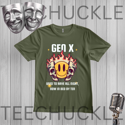 A green graphic t-shirt displayed on a gray wood plank background, featuring a 'Gen X' theme with a flame skull and smiley face graphic. The image includes decorative silver theater masks in the top left and a vintage microphone in the bottom right