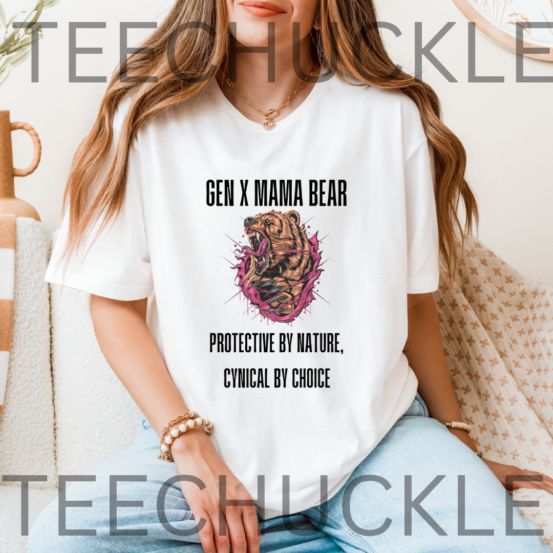 A woman wearing a white graphic T-shirt with a 'Gen X Mama Bear' design featuring a roaring bear illustration and the text 'Protective by Nature, Cynical by Choice'.