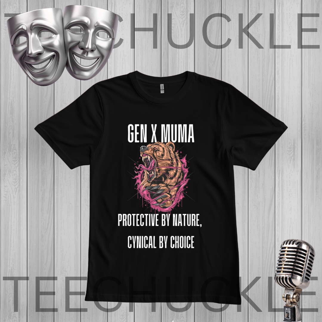 A black short-sleeve graphic t-shirt displayed against a gray wood-plank background. The shirt features a graphic of a roaring tiger inside a pink and orange burst, with the white text 'GEN X MUMA' above and 'PROTECTIVE BY NATURE, CYNICAL BY CHOICE' below.
