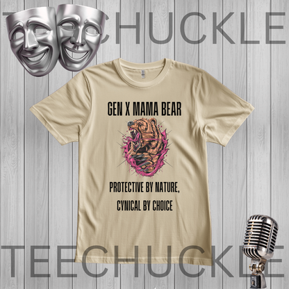 A sand graphic t-shirt displayed on a gray wood-plank background, featuring a 'Gen X Mama Bear' design with a bear illustration and the text 'Protective by Nature, Cynical by Choice'. The image includes decorative silver theater masks and a vintage microphone