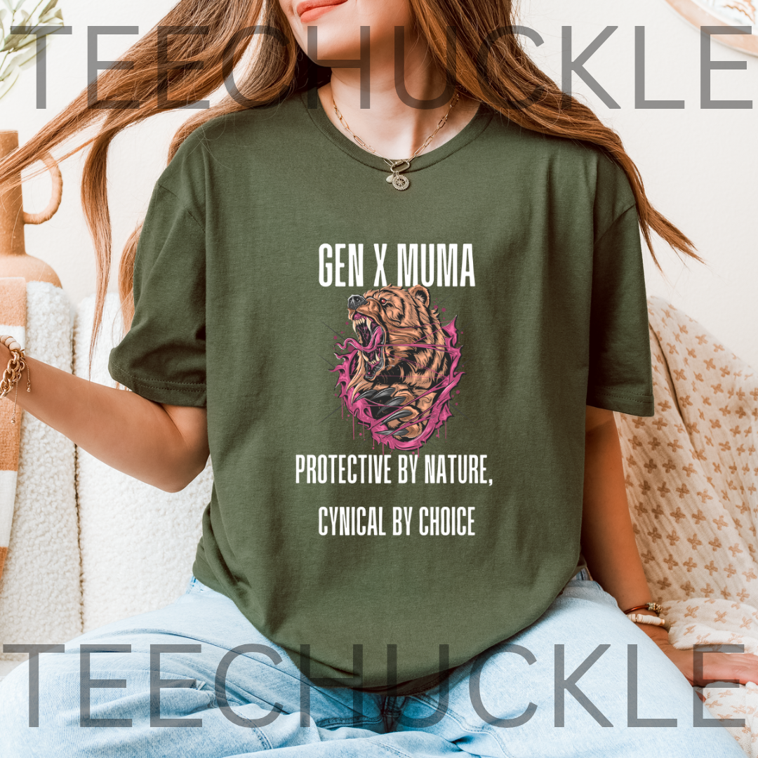A woman wearing a green graphic t-shirt with a tiger illustration and the text 'GEN X MUMA PROTECTIVE BY NATURE, CYNICAL BY CHOICE'. 
